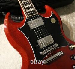 Gibson Sg Standard Heritage Cherry #215920162 Yv139 translated in French is: Gibson Sg Standard Cerise Patrimoine #215920162 Yv139