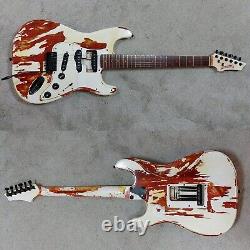 Guitare Électrique Relique, type S unique sur commande. Rouge Transparent avec Relique Blanche